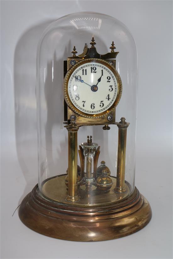 Brass clock under a glass dome